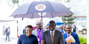 President William Ruto holding an umbrella while attending the official launch of the Mission for Essential Drugs and Supplies’ Microbiology Laboratory in Syokimau, Machakos County on November 22, 2023