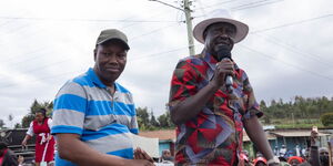 Nakuru Governor Lee Kinyanjui (left) and Azimio la Umoja movement leader Raila Odinga (right) at a rally in Nakuru County on January 23, 2022