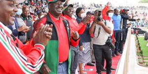 ODM leader Raila Odinga (left) and DP William Ruto cheer at Nyayo Stadium on October 3,2020.