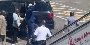 A photo of Azimio Leader Raila Odinga alighting from a plane at JKIA