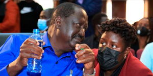 Photo of ODM leader Raila Odinga with his daughter Winnie Odinga  during funeral service for the late former Gem MP Jakoyo Midiwo at Citam Valley road on June 24, 2021