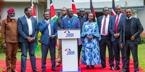 A photo of Raila Odinga speaking to the press flanked by top Azimio leaders at SKM Centre on Tuesday, July 4, 2023.