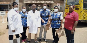 Ministry of Health officials preparing to random screen members of the public for COVID-19 symptoms at Nairobi Railway Station, in Nairobi on Saturday, March 21, 2020.