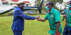 ODM leader Raila Odinga and Nominated MP Wilson Sossion during a party in Bomet on Saturday, September 19.