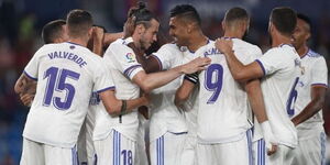 Real Madrid players celebrate scoring a goal in a past match. 