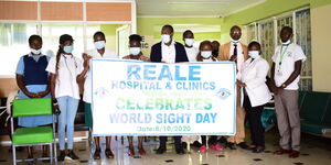 Medical staff at the Reale Hospital holding a hospital banner on October 8, 2020