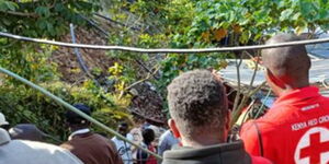 File image of Red Cross officials aiding a flood victim in Kenya 