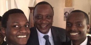 resident Uhuru Kenyatta (centre) with David Murathe's son Davidson Wakairu Gatuhi (right) at an event on August 11, 2017
