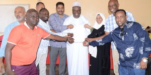 The Kenya National Chamber of Commerce and Industry (KNCCI) President Richard Ngatia (centre) with coast region delegates after his endorsement on Monday 8, 2023