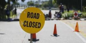 A signage showing a road that is closed for construction