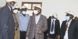 Transport CS James Macharia and Kenya Railways Managing Director Philip Mainga (left) in one of the classes as they inspected Railways Training Institute's newly constructed classes and laboratories.