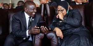 President William Ruto sharing a light moment with his Tanzanian counterpart, Samia Suluhu in Namibia on February 24, 2024.