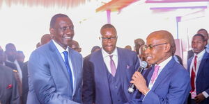 Safaricom CEO Peter Ndegwa (right) and President William Ruto.