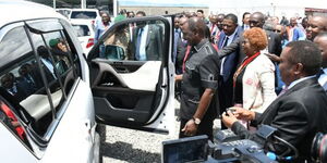 President William Ruto inspecting a car during an auction in Nakuru County in April 2024.