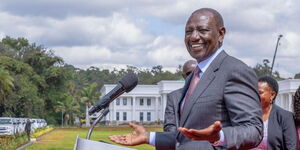 Ruto laughing hands