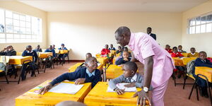 President William Ruto engaging students of Lenana Primary School on May 13, 2024