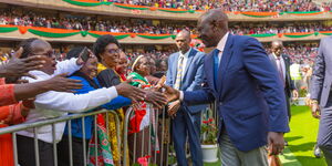 President Ruto greeting women at Kasarani