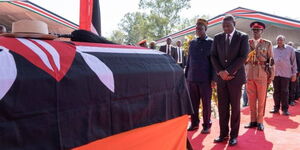 President Ruto taking a moment of respect during Raila Odinga's funeral service at JOOUST, October 19, 2025.