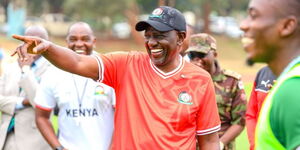 President William Ruto interacting with Harambee Stars players