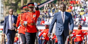 President William Ruto flanked by the military during the 61st Madaraka Day in Masinde Muliro Stadium.