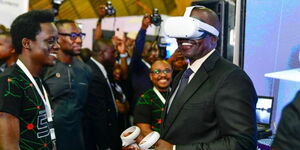 President William Ruto tries out virtual reality headsets at the Jamhuri Tech and Innovation Summit at KICC, Nairobi, on December 11, 2022.