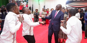 President William Ruto dancing with choir members at State House Nakuru on December 31, 2023.