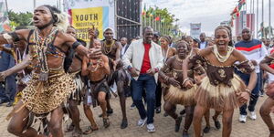 President William Ruto dancing along traditional dancers at KICC on December 11, 2022.