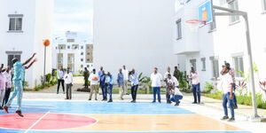 President William Ruto practising loop shooting at a basketball court in Mombasa County on November 2023.