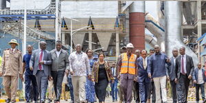 President William Ruto (in white helmet and a reflector jacket) with other Cabinet Secretaries at a manufacturing plant on April 8, 2024