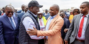 President William Ruto (in a cap) greets Lang'ata MP Phelix Odiwuor Jalang'o during the inspection of the affordable housing units in Nairobi on October 3, 2022.