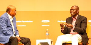 President William Ruto (right) and billionaire Mo Ibrahim engage during the Mo Ibrahim Foundation African Leadership ceremony at KICC, Nairobi on April 29, 2023.   