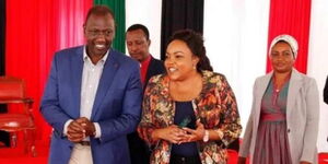 A photo of President William Ruto (left) conversing with former Kirinyaga Woman Representative Purity Ngirici