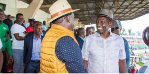 President William Ruto (right) shakes hands with Azimio Leader Raila Odinga (left) at Nyayo Stadium on Sunday, May 14, 2023.
