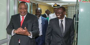 Former President Uhuru Kenyatta and President William Ruto conversing after a meeting on March 26, 2019.