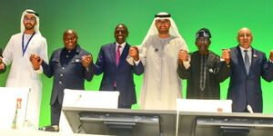 President William Ruto alongside President Évariste Ndayishimiye (Burundi) and President Ahmed Tinubu holding hands with COP28 officials in Dubai on December 2, 2023.