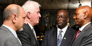 President William Ruto (left) and Kenya's High Commissioner to the United Kingdom Manoah Esipisu (centre) greet Australian engineer Michael Sort in London on May 6, 2023. 