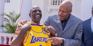 President William Ruto being gifted a Lakers jersey by NBA champion Ron Harper at State House on November 29, 2023.