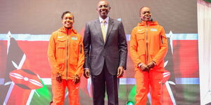 President William Ruto (centre) poses for a photo with athletes Faith Kipyegon (left) and Mary Moraa (right) at Talanta Plaza in Upper Hill, Nairobi on Friday, September 1, 2023