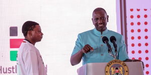 President William Ruto (right) with Tuk Tuk driver Harrison Kenga at Statehouse during the Hustler Fund Anniversary on November 30, 2023.