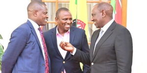 President William Ruto (right) conversing with Kiharu MP Ndindi Nyoro (left) and Kikuyu MP Kimani Ichung'wah.