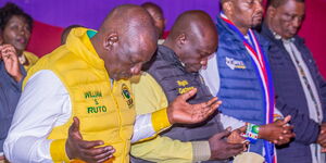 From left to right: President William Ruto, his deputy Rigathi Gachagua, Public Service CS Moses Kuria and Attorney General Justin Muturi pray during a church service in 2022. 
