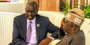 Nigerian President Bola Tinubu engages President William Ruto on December 1, 2023 at Dubai, United Arab Emirates. 