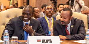 President William Ruto (left) and Ethiopian Prime Minister Abiy Ahmed during the 19th Non-Aligned Movement (NAM) Summit, Kampala, Uganda on January 19, 2024. 