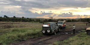 A file image of tourist vehicles stuck in the mud during a safari