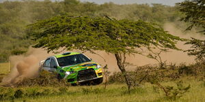 A KCB Safari Rally car drifts in the dust in Naivasha in June 2022