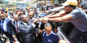 Nairobi Governor Johnson Sakaja greeting city residents during a tour in the CBD on April 18, 2023.