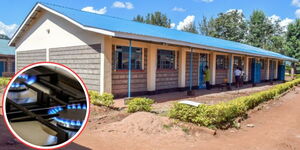 Teachers walk in a school compound in Kenya and an LPG Gas burner on the left