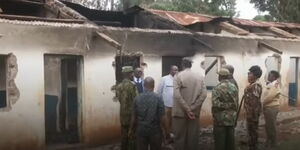 Security Officers led by County Commissioner of Meru, Jacob Ouma inspecting the fire incident on August 13, 2024.