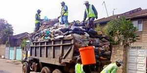 Several garbage collectors at work in Nairobi