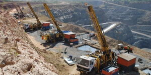 Several trucks at a mining site in Kenya